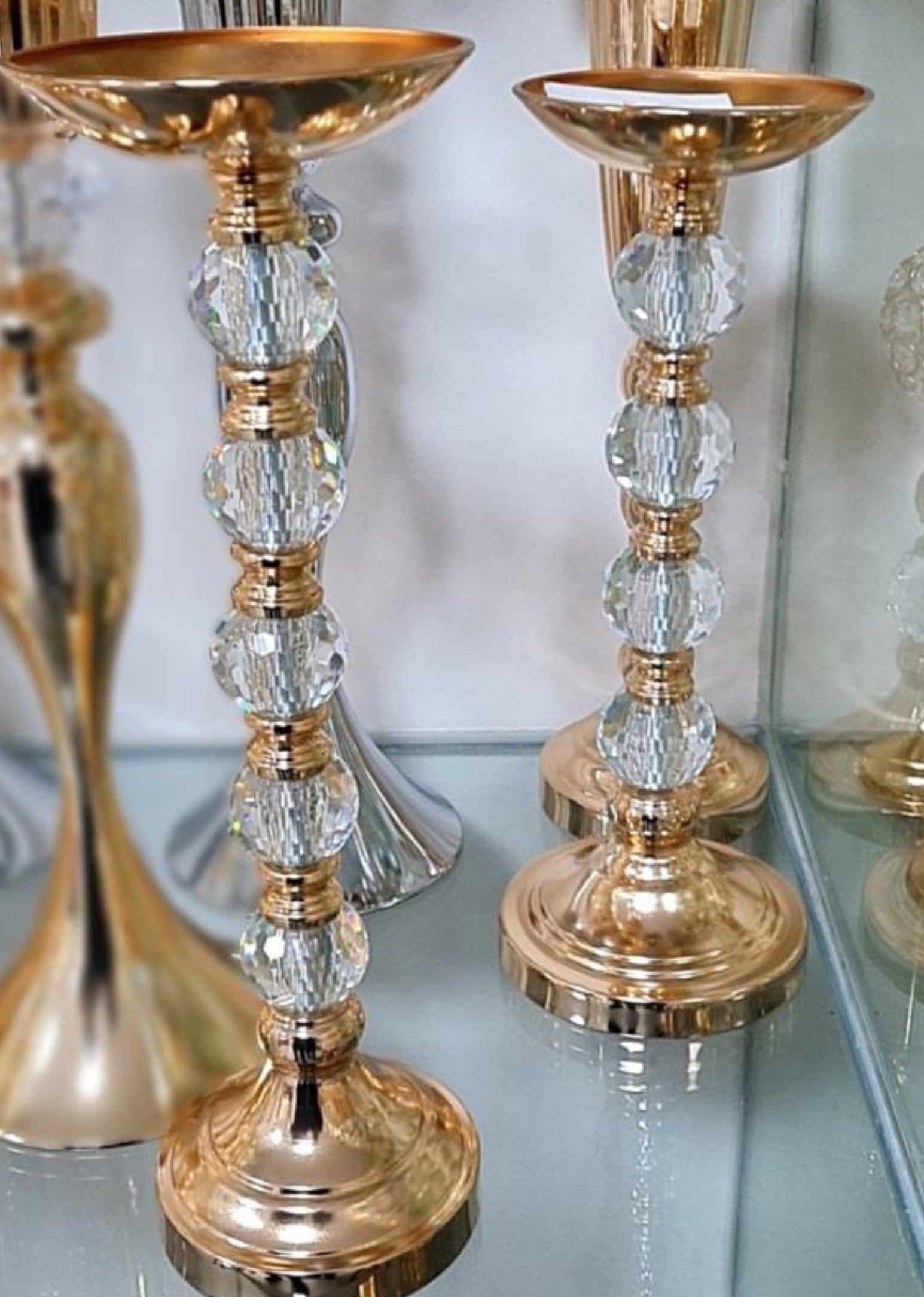 Gold metal candle holders with acrylic ball center Ginni Bloom Mumbai